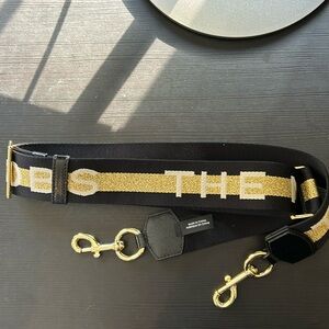 Marc Jacob’s gold hardware gold stripe black purse strap